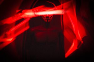 A photo of a Guy Fawkes V For Vendetta mask on a mannequin using light painting