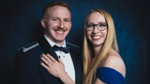 A professional photograph of a newly married man and woman